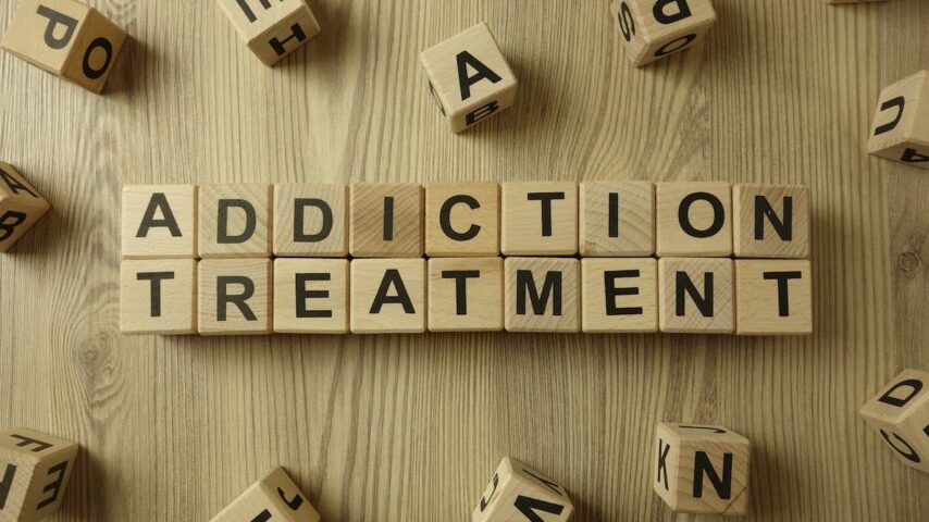 Addiction treatment texts from wooden blocks
