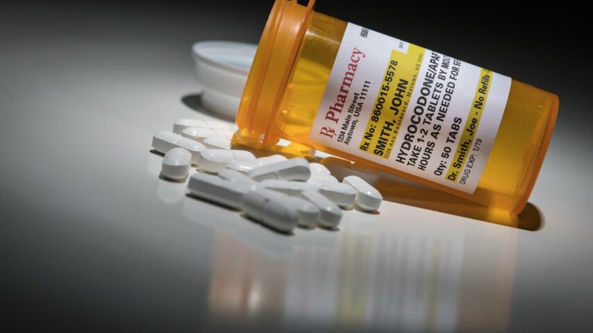Hydrocodone pills and prescription bottle